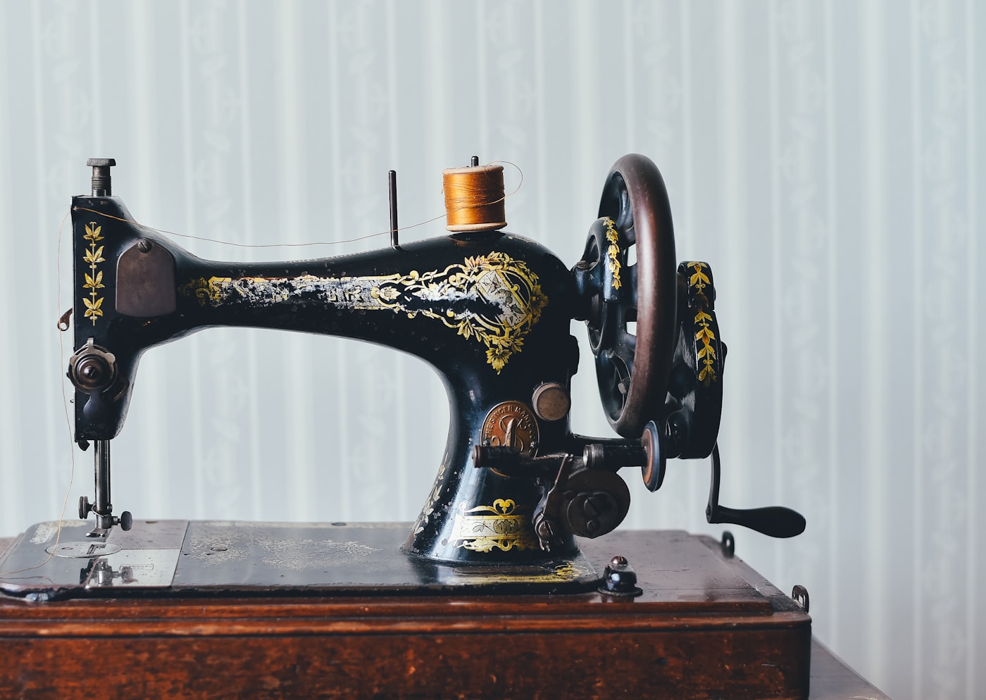 A vintage hand-crank sewing machine